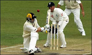 Western Australia's Ryan Campbell sweeps the ball past England's Alec Stewart