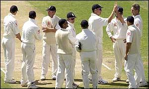 The England team congratulate Andrew Caddick after his performance in Perth