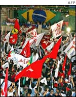 Thousands of supporters wave flags as they hear Lula has won