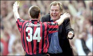 Royle celebrates with Mark Kennedy as Manchester City gain promotion to the Premiership in May 2000