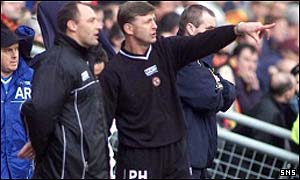 Maurice Malpas and Paul Hegarty watch the draw with Thistle
