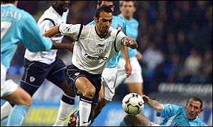 Youri Djorkaeff runs at the Sunderland defence