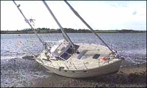 Yachts upended at Levington Harbor in Suffolk 