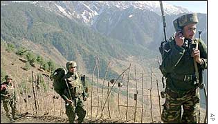 Indian soldiers patrol along the Line of Control