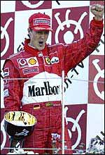 Michael Schumacher celebrates victory at the Japanese Grand Prix