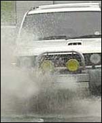 Vehicle wades through water