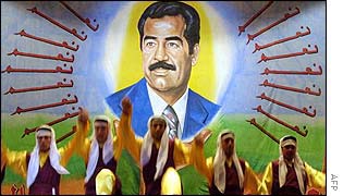 Poster of Saddam Hussein at folk concert