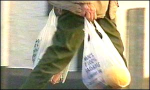 Shopper outside the Co-op in Dalston