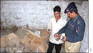 Bomb disposal squad examines explosives at suspected militant hideout