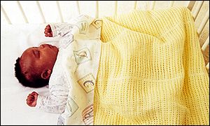 Baby in cot