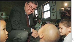 Mr Van Schalkwyk talks to children in an education centre 