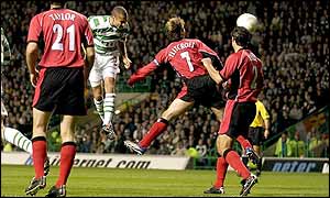 Celtic striker Henrik Larsson powers a header at the Blackburn goal