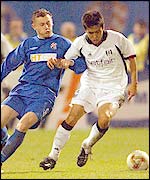 Dinamo Zagreb's Ivica Olic (left) chases Fulham's Junichi Inamoto