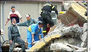 Rescue workers in the debris of the school in San Giuliano di Puglia