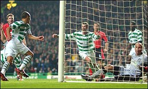 Chris Sutton (right) rushes to congratulate scorer Henrik Larsson