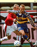 Parma's Hidetoshi Nakata holds off Wisla Krakow's Maciej Stolarczyk 