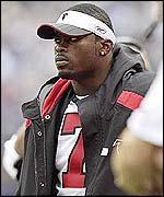 Michael Vick watches Atlanta from the sidelines