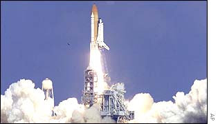 Space shuttle taking off