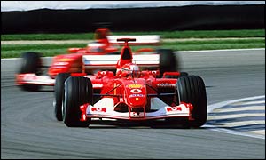 Michael Schumacher leads Rubens Barrichello at the 2002 US Grand Prix
