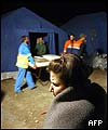 A woman waits for a tent in an Italian Civil Protection camp near San Giuliano Di Puglia 