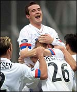 Barry Ferguson congratules goalscorer Bob Malcolm