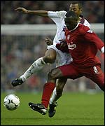 Edouard Cisse challenges Emile Heskey