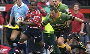 Gloucester wing Marcel Garvey cuts inside Northampton's Nick Beal 