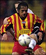 Gerry Britton shields the ball