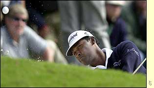 Vijay Singh plays a chip out of a bunker
