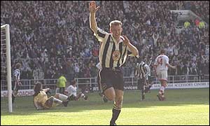 Alan Shearer celebrates scoring against Sunderland in 1997