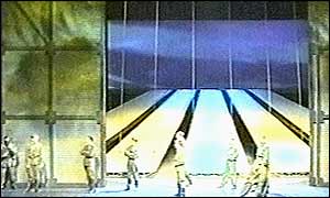 A gunman and the actors on stage