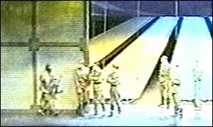 A gunman orders the actors off stage