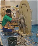 Layers of clay are built up on the sculptures