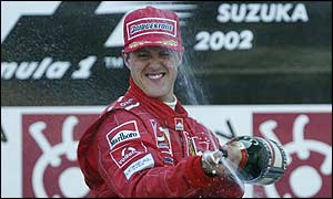 Michael Schumacher celebrates his 11th win of the year