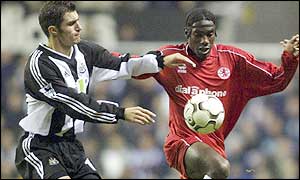 Newcastle's Aaron Hughes closes down Boro striker Joseph Desire-Job