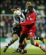 Newcastle's Aaron Hughes and Middlesbrough's Joseph-Desire Job challenge for the ball 