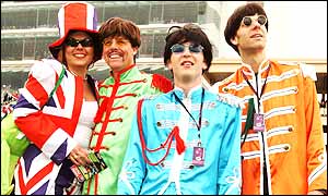 Fans dressed as the Beatles get ready for the start of the big race at Flemington, the Melbourne Cup