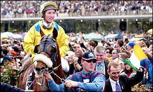 Media Puzzle is led into the winner's enclosure after the race