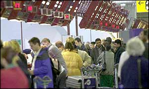 Passengers queuing at airport terminal