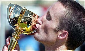 Jockey Damien Oliver with the Melbourne Cup