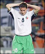 Ireland's Matt Holand reacts to his penalty miss against Spain the the last 16 of the World Cup