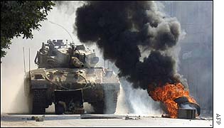 Israeli tank and burning tyres in Nablus, West Bank