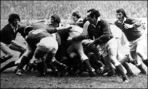 Edwards (with ball) in action for Wales during the 1970s