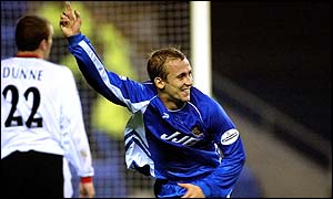 Wigan striker Neil Roberts celebrates scoring