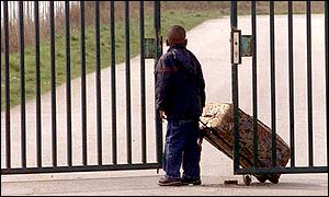A refugee standing outside the Sangatte camp