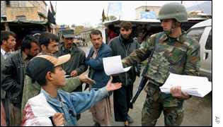 Turkish soldier distributes Ramadan timetables in Kabul, Afghanistan