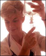 Medical worker with IV drip, Eyewire