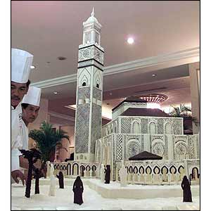 Indonesian chefs put the finishing touches to a 2.6 meter cake depicting the Hassan II mosque in Morocco (AP)