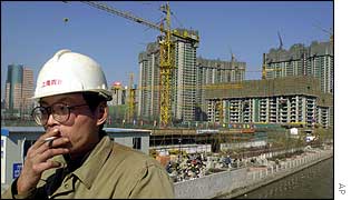 Middle-aged construction worker smoking a cigarette 