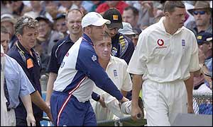 Simon Jones is carried from the field after injuring his knee during the afternoon session